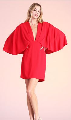 Whether you're going to a wedding, gala, shower or Holiday party, this amazing cape dress will be sure to wow the crowd! This dress features a gathered, tuck-pleat v neckline, cape design on the shouldersback and a mini length. Pair with strappy heels and a clutch for an elegant, timeless look. Pre-draped Cape Evening Dress, Flowy V-neck Mini Dress For Formal Occasions, Cocktail Dress With Draped Sleeves And V-neck, Cocktail V-neck Dress With Draped Sleeves, Chic V-neck Mini Dress For Wedding Guest, Flowy Pre-draped Party Dress, Spring V-neck Dresses With Structured Shoulders, Glamorous Dresses With Cape Sleeves For Gala, Flowy V-neck Dress With Draped Sleeves