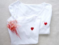 White T-shirt Small Heart T-Shirt White Red Heart Women T-shirt Little Heart T-shirt Red Heart Tshirt Birthday Gift Mother Day Birthday Gift ROUND COLLAR White T-shirt regular cut and breathable material. Soft and comfortable 100% cotton composition and its well-fitted cut. ✅ You can choose the color of glitter heart The heart size is 4,5 cmx 4,5 cm (1,7 inch x 1,7 inch ) for two hearts print  The heart size is 3,8 x 4 cm  (1,5 inch x 1,6 inch ) for one heart print  If you need a larger or small Red Short Sleeve T-shirt For Gift, Red Cotton Tops As Gift, Red Cotton Tops For Gifts, Red Crew Neck Top For Gift, Red Cotton Top For Gift, Mother's Day Crew Neck Top With Heart Graphic, Red Short Sleeve Tops As Gift, Family Matching Crew Neck Tops For Anniversary, Family Matching Red Tops For Birthday