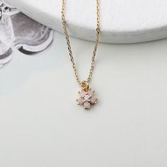 The necklace brings Inspired by the flower blossom. A detailed cubic Opal flower pendant dangles from a delicate 14k gold plated chain. Great for gift, everyday or special occasion.  Material : Brass, Cubic Zirconia Pendant : 6mm x 7mm Necklace Opal, Cz Necklace, Bridal Gift, Necklace Wedding, Pink Opal, Opal Necklace, Gold Plated Chains, Bridal Gifts, Flower Pendant