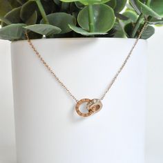 This elegant Rose Gold Necklace will be your new favorite. Complete your look without any effort. Delicate Roman letters printed on one of the interlocking hoops. Sparkly simulated diamonds compliments the elegant design. Materials:18K Rose Gold plated, AAA Cubic Zirconia, & Stainless Steel Sizes:16 inches with 2 inches extender Roman Letters, Beautiful Relationship, Beautiful Stones, Rose Gold Necklace, Two People, Roman Numerals, The Rings, The Gap, 18k Rose Gold