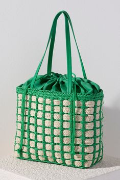 Accessorize with color this summer by carrying Shiraleah's Juanita Tote. Made from woven paper straw with a chic green cotton lining, this trendy bag will fit your favorite outfit perfectly. The drawstring closure ensures all your items are safely enclosed, while creating a unique silhouette that is sure to stand out from the crowd. Pair with other items from Shiraleah to complete your look! Boat Shoes Outfit, Buy Bags, Net Bag, Straw Tote, Purse Accessories, Woven Paper, Knitted Bags, Chic Boutique, Green Cotton