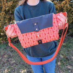 LOVE this hands-free bag when I'm on the go! Can be worn at an angle across the front, or lower and to the side. This Haralson Crossbody bag features vibrant fabric designed by Rashida Coleman-Hale of Ruby Star Society, and a natural black leather flap. With one exterior zipper pocket and one interior zipper pocket, there's a place for everything. The 1" wide cotton webbing strap is fully adjustable with rose gold tone hardware, and made extra long (adjusts up to 50"). Matching keychain included Functional Adjustable Crossbody Bag, Functional Orange Shoulder Bag For On-the-go, Adjustable Shoulder Bag With Removable Pouch For On-the-go, Adjustable Shoulder Bag With Snap Closure For Travel, Adjustable Red Shoulder Bag For Travel, Red Adjustable Shoulder Bag For Travel, Adjustable Bags With Snap Closure For Everyday Use, Adjustable Shoulder Bag With Snap Closure For Everyday Use, Adjustable Snap Closure Crossbody Bag