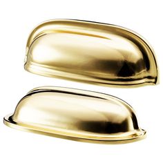 two shiny gold door handles on a white background