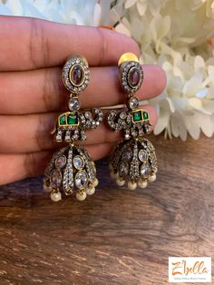 Victorian Finish Jhumka With Kundan And Green Stone Earrings Gold Tone Temple Jewelry Style Kundan Jhumkas With Intricate Design, Elegant Green Kundan Chandbalis, Green Tikka With Latkans For Festivals, Gold Plated Chandbalis With Stone Work In Temple Style, Gold Plated Temple Jewelry Chandbalis With Stone Work, Festive Jeweled Chandbali Tikka, Green Stone Work Chandbalis For Celebration, Green Temple Jewelry Tikka With Latkans, Green Chandbali Tikka For Festive Occasions