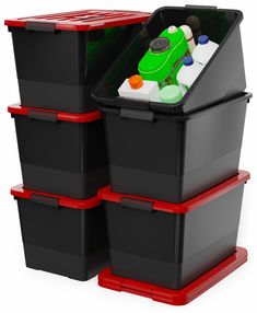 three plastic storage containers stacked on top of each other with one green frog in the middle