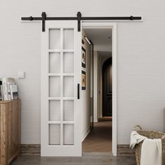 an open door leading to a hallway with white walls