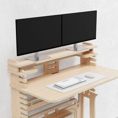 a computer desk with two monitors on it