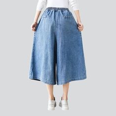 Short culottes denim pants online—excellent jeans for women from the 2022 Spring-Summer collection. Casual-style outfits are more comfortable to wear. Blue color denim is the most popular denim color, practically suits all other clothes. An unrubbed design provides a more sleek look. From a distance, you can’t tell the difference between culottes and a skirt, making them incredibly comfy. A high-waisted rise is particularly fit for those who want to lengthen their legs and highlight the figure. Summer High Rise Baggy Wide Leg Pants, Casual Medium Wash Wide-leg Cropped Jeans, Summer Wide Leg Jeans With Pockets, Knee-length Jeans With Pockets For Summer, Casual Relaxed Fit Cropped Culottes, Summer Wide Leg Cropped Cotton Jeans, Casual Dark Wash Wide-leg Cropped Jeans, Knee-length Jeans For Spring, Baggy Light Wash Summer Bottoms