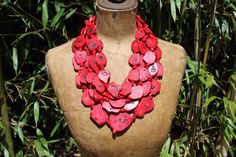 Chunky red coral multi strand bib statement necklace. In this gorgeous, eye-catching necklace you'll stand out from the crowd at any celebration or occasion.  Created with 5 stackable strands of vibrant red coral freeform slices and a sterling silver Bali style toggle closure.   The freeform coral medallions range in size from approximately 20 to 47mm. The 5 necklace strands measure approximately 21, 22, 23.5, 25 and 27.5 inches in length. The toggle closure measures approximately 36mm (bar) and 24mm (loop). This is a significant piece that weighs in at approximately 17 oz. Coral quiets the emotions and brings inner peace. It facilitates intuition, imagination and visualization. Clear Quartz Necklace, Red Coral Necklace, Bali Style, Bali Fashion, Rainbow Quartz, Raw Quartz, Necklace Chunky, Necklace Red, Crystal Crown