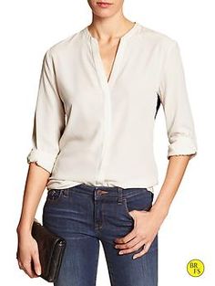 Factory Popover Blouse Fall V-neck Top With Placket, Elegant V-neck Top With Cuffed Sleeves, Chic Long Sleeve Blouse With Roll-up Sleeves, Collared Blouse With Concealed Placket For Work, Elegant V-neck Top With Button Cuffs, Chic Shirt With Button Cuffs For Work, Chic Workwear Shirt With Button Cuffs, Business Casual Button-up Blouse With Roll-up Sleeves, Chic White Tops With Concealed Placket