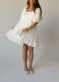 White Tiered Dress For Summer Day Out, White Tiered Summer Dress For Day Out, White Flowy Dress For Date Night, Breezy Mini Length Dress For Brunch, White Tiered Dress For Summer Vacation, Chic White Tiered Dress, White Fitted Tiered Dress For Day Out, Feminine Off White Dress For Day Out, White Flowy Tiered Dress For Summer