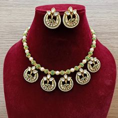 Description: Elevate your look with our Designer Gold Plated Kundan & Ruby Stone Necklace with Earrings. The intricate design and high-quality materials add a touch of elegance to any outfit. Perfect for special occasions or everyday wear, this set is a must-have for any fashion-forward individual. About: Eye-catching and unique jewelry that will set you apart. Gift this piece to a loved one, and see their face light up with joy. Best for gifting or for personal use, wear it to any occasion and Festive Meenakari Metal Jewelry Sets, Temple Jewelry Sets With Matching Earrings, Elegant Meenakari Metal Jewelry Sets, Diwali Party Jewelry Sets, Festive Round Kundan Necklace In Metal, Festive Round Kundan Metal Necklace, Festive Metal Kundan Necklace, Festive Round Jewelry Sets With Matching Earrings, Festive Kundan Necklace With Matching Earrings