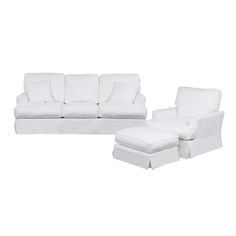 a white couch and ottoman sitting next to each other