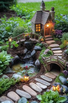 a fairy garden with a small house and pond