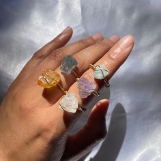 "Listing is for ONE raw crystal ring.    PLEASE NOTE: Due to the natural state of the crystals and stones, size, shape and color WILL vary. NO two crystals or stones will be exactly the same. **PLEASE KEEP IN MIND that these crystals are chunky, and though sizes and shapes VARY, the smaller your ring size, the larger it'll be and look on your finger but i will TRY to use smaller crystals on smaller rings sizes unless otherwise requested. Please be aware that these are natural stones and crystals Quartz Crystal Ring With Gemstone For Gift, Quartz Crystal Ring As A Gift, Gift Crystal Quartz Ring With Gemstone, Healing Natural Stones Open Crystal Ring, Spiritual Crystal Ring With Natural Stones For Gift, Gold Amethyst Ring With Natural Stones As Gift, Adjustable Amethyst Crystal Ring, Healing Crystal Ring With Natural Stones, Gift Crystal Open Ring With Natural Stones