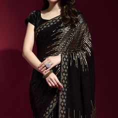 Black & Golden colored saree is made from georgette fabric which is highlighted with beautiful sequins embroidered work as shown. comes along unstitched banglori satin blouse which you can customise as per your design/style. Occasion - You can wear this saree for party and functions. Note:- The actual product may differ slightly in color and design from the one illustrated in the images when compared with computer or mobile screen. Measurements: Saree : Georgette : 5.5 Mtrs Blouse : Georgette : Black Embroidered Pre-draped Saree For Navratri, Festive Black Embroidered Pre-draped Saree, Semi-stitched Black Art Silk Blouse Piece, Embroidered Georgette Pre-draped Saree For Party, Party Wear Embroidered Pre-draped Saree For Festivals, Embroidered Blouse Piece For Diwali Evening, Black Georgette Pre-draped Saree With Resham Embroidery, Evening Embroidered Semi-stitched Saree, Navratri Saree With Sequins