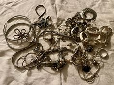 This is a 1/2 pound lot of broken and not, vintage and newer craft jewelry. The majority of these are wearable or for crafts, Silver tones There are necklaces, earrings, bracelets, key rings, broken pieces etc etc. Both vintage and modern. Perfect for your slow stitches or scrapbooking projects. Or other works of art This is NOT a mystery bag or box, so there will be no surprises You get everything in the picture. So study the pictures carefully Various materials such as plastic, metal, beads, etc etc Costume Jewelry For Accessorizing, Vintage Silver Jewelry With Unique Variations, Vintage Charms For Crafting Jewelry, Vintage Handmade Assorted Jewelry, Handmade Vintage Jewelry In Assorted Colors, Silver Charms Jewelry For Accessorizing, Assorted Vintage Handmade Jewelry, Silver Charms Jewelry, Handmade Assorted Jewelry In Various Shapes