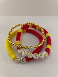 Kansas City Chiefs bracelet stack | KC Chiefs bracelets | stretchable bracelets Red Stretch Bracelet For Friendship In Trendy Style, Trendy Red Stretch Bracelet For Friendship, Trendy Adjustable Red Stretch Bracelet, Trendy Red Adjustable Stretch Bracelet, Red Bracelets With Letter Beads For Friendship, Personalized Red Beaded Bracelets For Friendship, Red Letter Beads Bracelets For Friendship, Stacked Adjustable Beaded Bracelets For Friendship, Trendy Personalized Red Bracelets