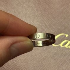 Authentic Cartier Wedding Band Love Ring In White Gold Size 52. Purchased Online Aug 25, 2022. Certificate, Box, And Bag Will Be Included. Receipt Will Not Be Included As It Has My Personal Information Along With Other Items I Had Purchased. There Are Normal Wear And Tear As Pictured However, It Could Be Easily Cleaned And Buffed Out At The Cartier Store For Free. I Have Not Gotten It Serviced Yet. I Am Selling Because I Don’t Use This As Much Since The Sizing Ended Up Being Too Small And I Felt Like The White Gold Doesn’t Suit Me. So, I’m Trying To Sell My White Gold Jewelry. I Cannot Lower My Price By Much As At Its Current Price I’m Already At A Significant Loss. Designer White Gold Promise Ring, Wedding Couple Rings With Vs Clarity And Round Cut, Cartier Wedding Rings With Vs Clarity, Cartier Polished Finish Wedding Ring, Cartier Polished Wedding Ring, Designer Engraved Jewelry For Wedding, Polished Diamond Couple Rings For Wedding, Luxury Diamond Cut Couple Rings For Wedding, Luxury Wedding Couple Rings With Diamond Cut