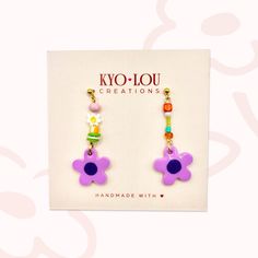 Warm welcome to my shop  Add a pop of colour to your look with these cute, mini handmade daisy dangle earrings! 🌸 Daisy Colour: Violet Blooms 🌸 Materials: Lightweight polymer clay earrings with assorted beads, 316L surgical stainless steel gold studs, front side coated with resin. 🌸 Drop length: 5cm (length vary slightly by a few mm) 🌸 Width: 1cm (at it's widest) 🌸 The beads alongside the daisy will vary slightly in colour and size, making your pair truly unique! 🌸 Each pair comes an organ Playful Purple Earrings For Gift, Playful Purple Earrings For Gifts, Trendy Adjustable Earrings For Birthday, Playful Purple Dangle Jewelry, Playful Multicolor Flower Earrings As Gift, Trendy Purple Flower Earrings For Gift, Trendy Handmade Earrings For Birthdays, Trendy Handmade Earrings For Birthday, Trendy Birthday Earrings For Pierced Ears