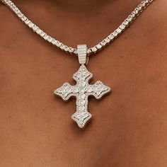 Introducing the Iced Gothic Cross in White Gold - a stunning addition to your pendant collection. Crafted with a durable 14k White Gold finish and hand-set stones, this cross is guaranteed to make a statement! Pair this piece with our 3mm Tennis Necklace in White Gold for a complete, elevated look. This product is guaranteed for life - GLD will repair the item should you experience any defects in craftsmanship or breakage. Specifications - 35mm x 42mm (Width x Height) - Bail: Fits up to 5mm Tenn Iced Cross Necklace, White Gold Cross Jewelry For Spiritual Style, Spiritual White Gold Cross Jewelry, Diamond White Cross Pendant Jewelry, White Gold Bling Cross Jewelry, Iced Out White Gold Cross Pendant Jewelry, Spiritual Diamond-cut Cross Jewelry, Spiritual Cross Jewelry With Diamond Cut, Spiritual Diamond Cut Cross Jewelry