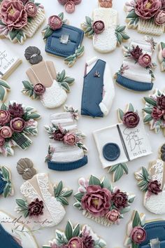 many decorated cookies with flowers and shoes on them