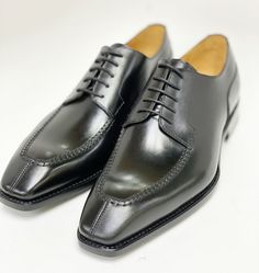 Style: 20141-2002-Black Simple, Elegant, Stunning! Completely Handmade, this Hand Burnished lace-up oxford from the Ugo Vasare collection features Goodyear Welted construction, soft Calfskin lining, cushioned insole, Split-Toe, a stitched welt and a full Leather sole! Matching Belt Available. Don't see your size? This style may be special ordered. Luxury Lace-up Oxfords For Business Casual, Fitted Lace-up Shoes For Semi-formal Occasions, Luxury Lace-up Oxfords For Work, Fitted Leather Lace-up Shoes For Derby, Luxury Fitted Oxfords For Semi-formal Occasions, Fitted Lace-up Shoes With Leather Sole For Workwear, Luxury Fitted Lace-up Shoes With Brogue Detailing, Elegant Fitted Derby For Formal Occasions, Elegant Fitted Lace-up Shoes With Leather Lining