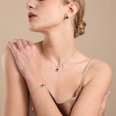 Eye-catching and elegant, this sparkling necklace and earring set is a perfect, considerate gift for that special someone. Featuring several intricate geometric designs of a birthstone-coloured gem framed by smaller cubic zirconia stones, this piece makes for an impactful, stylish statement regarding the importance of the wearer's symbolic birthstone. Show how much you care, and how much they mean to you with this thoughtful piece. As the May birthstone, the Emerald is worn to encourage intellect and integrity. This product is also available as a matching bracelet. Rhodium Plated | Cubic Zirconia Nickel, Lead, and Cadmium Free Product Code: RG0001RE Collection: Boxed Type: Set Material: Base Alloy Metal & Cubic Zirconia Dimensions: Adjustable from 41 to 46.4cm x 1mm x 5mm x 20cm-23cm Penda Emerald Birthstone, Sparkle Bracelet, Sparkle Necklace, Birthstone Colors, Clasp Bracelet, Emerald Color, May Birthstone, Free Product, Colored Gems