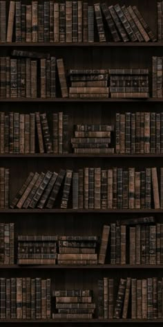 a book shelf filled with lots of books on top of wooden shelves next to each other