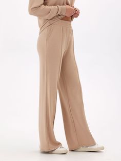 Elevate your loungewear game with our Angela Modal Terry Wide Leg Pants! Made with a buttery soft material and featuring a thick stretchy waistband, these pants offer both comfort and style. The wide leg design adds a touch of elegance to your casual look. Don't settle for ordinary loungewear, treat yourself to our elevated piece. Comfortable Solid Color Lounge Pants, Solid Wide-leg Yoga Pants For Lounging, Solid Color Harem Loungewear Pants, Versatile Full-length Lounging Sweatpants, Versatile Full-length Sweatpants For Lounging, Versatile Full Length Lounging Sweatpants, Comfy Wide-leg Bottoms With Elastic Waistband, Comfy Wide Leg Bottoms With Elastic Waistband, Comfy Wide Leg Sweatpants With Comfort Waistband