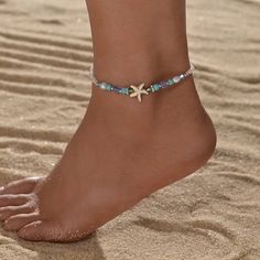 Step into the enchanting realm of summer with our Ocean Style Blue Beads Mixed Starfish Ladies Anklet, a mesmerizing piece of foot jewelry that captures the essence of the sea. Crafted with meticulous attention to detail, this anklet exudes coastal elegance with its delicate blue beads interspersed with whimsical starfish motifs. Each bead whispers of ocean waves, while the starfish adds a touch of playful charm, reminiscent of lazy days spent by the shore. Whether you're wandering along sandy b Starfish-shaped Beaded Beach Jewelry, Summer Strand Anklet With Starfish Charm, Summer Beach Anklets With Starfish Charm, Starfish Anklets For Summer Vacation, Adjustable Starfish Anklet For Summer, Summer Vacation Starfish Anklets, Ocean-inspired Summer Beach Anklets, Summer Strand Beaded Bracelets With Starfish Charm, Starfish Charm Anklets For Beach Vacation