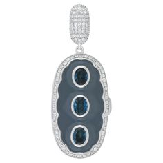 Elegant and Exquisitely detailed Photo Box Gold Pendant, center set with 1.34Ct Oval Cut London Blue Topaz surrounded by contrasting Enamel and accented with micro pave Diamonds, weighing approx. 0.57 Cts. total carat weight. This PhotoBox pendant has a unique place to hold 2 pictures of your closed ones even closes to your heart. Beautifully Hand crafted in 14 Karat White Gold Product Details: - Primary Stone: - Londan Blue Topaz Primary Stone Shape: - Oval Shape Primary Stone Cut: - Faceted Pr Unique Place, White Gold Pendant, Photo Box, Gold Birthday, London Blue Topaz, Stone Cuts, London Blue, Micro Pave, Pave Diamonds