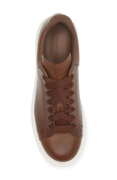 A chunky rubber platform elevates this lace-up sneaker with a removable, padded insole that provides signature comfort. 1 1/2" heel, 38mm (size 43MI) Lace-up style Removable, cushioned insole Leather upper/textile and leather lining/rubber sole Made in Italy Designer Shoes High-top Lace-up Sneakers With Boost Midsole, Lace-up High-top Sneakers With Boost Midsole, Sporty Lace-up High-top Sneakers In Calf Leather, Calf Leather Sneakers For Streetwear, Low-top Calf Leather Sneakers With Laces, Calf Leather Lace-up High-top Sneakers, Lace-up High-top Calf Leather Sneakers, Luxury High-top Chunky Sneakers With Rubber Sole, Luxury Low-top Sneakers With Laces