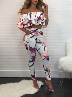 This sassy but sweet two piece set is sexy with a lovely floral pattern. Featuring a ruffled off-the-shoulder top and skinny fitted pants with an elastic waist. Pairs perfectly with wedges, heels or booties and is made with a blend of polyester, cotton and spandex for a fabulous fit. Comes in two fabulous floral color patterns. Two Piece Outfits Classy, Floral Pants Outfit, Pants And Top, Two Piece Outfits, Afrikaanse Mode, Outfits Classy, Ruffle Crop Top, Casual Rompers, Over 50 Womens Fashion