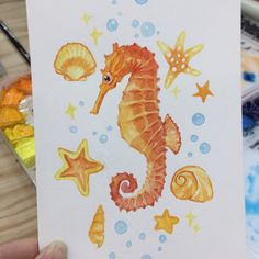 a drawing of a seahorse with starfish and shells on it's back