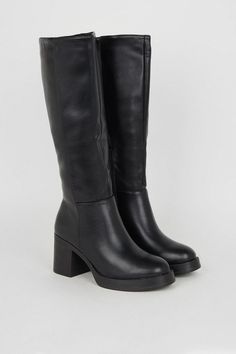 Knee-high silhouette crafted from supple faux leather Chunky platform sole for a subtle height boost Mid-height block heel measuring between 5 and 6.5cm Sleek pull-on style with stretch panel at the back Durable synthetic outsole for enhanced traction Exude a confident and stylish vibe with these versatile knee-high boots from Oasis. The faux leather construction lends a polished look, while the platform sole and mid-height block heel provide a comfortable stride. Pair them with a floral midi dress for a feminine touch at casual events or family gatherings, or team them with skinny jeans and a cosy knit for an effortlessly chic daytime ensemble. Cute High Heels Boots, Black Knee High Boots Low Heel, Low Heel Knee High Boots, Boots Fall 2024, Knee High Boots No Heel, Black Heeled Boots Outfit, Knee High Boots Aesthetic, Tall Fall Boots, High Shoes Boots