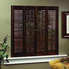 a window with wooden shutters in a living room