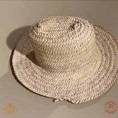 This Straw Hat sun are 100% handmade by artisans in Northern Morocco. and has been completely handmade. The dried palm leaf hat made from wild palm leavesare by free hand, with the straw Hat Natural palm. This Hand-Woven straw hats. Perfect for sunning your buns but keeping your pretty face shaded this summer! Features : Material : Harvested from the Doum palm Color : As Picture Size: Approx. 40 to 50 cm / 15.7 to 19.6 Inches Shap : Rounded Brand : Grand Moroccan Bazaar Condition : New Ethnic and traditional look Can be reshaped when wet. Ideal for the beach or working in the garden, a decoration on the wall. NOTE : Due to the nature of artisanship, a small variation in color, size, or design may occur. which make them even more beautiful and charming. Artisan Woven Straw Hat For Summer, Artisan Handwoven Summer Straw Hat, Handwoven Boater Hat With Short Brim In Palm Leaf, Artisan Straw Hat For Vacation, Handwoven Palm Leaf Panama Hat For Vacation, Handwoven Palm Leaf Straw Hat For Summer, Handwoven Palm Leaf Brimmed Boater Hat, Handwoven Palm Leaf Boater Hat, Handwoven Panama Hat From Palm Leaf For Vacation