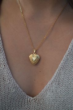 18-karat gold plated dainty heart locket hangs on a sturdy 18-karat gold plated stainless steel chain. Choose your chain length from the drop-down menu.  Chain length (model wears): 18 inches  You can choose the locket as is, without photos, or have it personalized with your photo (s). The picture you choose will be printed on professional photo paper.  ENGRAVING SERVICE  You can choose the locket as is, or have it personalized by engraving your birth flower, initial or a short message at the ba Dainty Gold Locket Necklace With Charms, Dainty Gold Plated Locket Necklace Gift, Gold Medallion Jewelry For Valentine's Day, Dainty Gold Locket Jewelry, Dainty Gold Plated Locket Jewelry, Gold Plated Locket Necklace For Wedding, Gold Plated Pendant Locket Necklace For Weddings, Gold Plated Heart Locket Necklace As A Gift, Gold Plated Heart Locket Necklace Gift