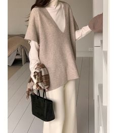 ▶ Colors ◀ Beige Brown Black ▶ Size ◀ One size(Free) ▶ Fabric ◀ Wool / Acrylic  ▶Size Spec◀ Total Length : 66cm Back Length : 70cm Chest : 60cm(Around 120cm as circular) Neck drop : 30cm -------------------------------------------- ▶ SHIPPING Information ◀ Delivery usually takes 10~15 business days. (Korea Post EMS) Even it is express shipping, recently it is not easy to get air space flexibly. Please, kindly wait a bit and be patient for us. *Delivery cost different from each country* --------- V-neck Knit Top For Winter Layering, V-neck Sweater Vest For Fall, Cozy V-neck Sweater Vest For Fall, Trendy Oversized Sweater Vest For Fall, Everyday Knit Sweater Vest For Fall, Everyday Fall Knit Sweater Vest, Fall Knit Sweater Vest For Everyday Wear, Trendy Winter Sweater Vest For Layering, Trendy Sweater Vest For Winter Layering