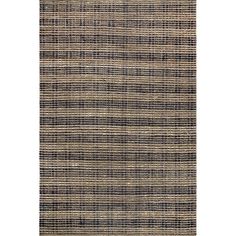 an area rug with black and beige stripes