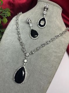 Gorgeous fine quality imitation jewellery  CZ black with CZ diamonds studded necklace with white gold rhodium plating and matching Earrings Item contains: Necklace and earrings AAA quality cubic zirconia used. Highest quality and craftsmanship Necklace Fitting is adjustable Earrings Closure: Pushback Necklace Closure: chain with Hook Details-  -Handmade item -Delivery from a small business in India -Materials: white rhodium, stones, cz, zircon, American diamond -Jewellery type: Earrings, Necklace -Style: Art deco *CARE INSTRUCTION* You can use Jewelry for years together with the help of below jewelry care instructions. * Protect from sharp blows/scratches and extreme temperature. * Avoid contact with perfumes, sprays, chemicals and water. * Keep in a clean, dry and airtight Zip-pouch. * Wi Luxury Black Spinel Necklaces For Formal Occasions, Cz Jewellery Sets, Necklace Closure, American Diamond Jewellery, Zirconia Necklace, Studded Necklace, Jewelry Care Instructions, Cz Necklace, Cz Jewelry