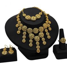 Indulge in luxury with this exquisite Necklace Set, perfect for wedding parties. With its opulent design and superior craftsmanship, this set features a necklace, bracelet, earrings, and ring. Make a lasting impression and elevate your style with this luxurious jewelry set.' Gold Alloy Jewelry, Gold Alloy Costume Jewelry, Gold Costume Jewelry Made Of Alloy, Gold Alloy Jewelry With Elegant Design, Elegant Gold Alloy Jewelry, Elegant Gold Metal Jewelry, Gold Alloy Bridal Costume Necklace, Gold Alloy Bridal Necklace In Costume Jewelry Style, Gold Alloy Bridal Necklace Costume Jewelry