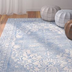 a blue and white area rug on the floor