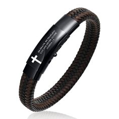 a black and brown bracelet with a cross on the front, in braided leather