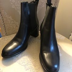 Brand New Quality Soft Leather Black Boots. Euro Size 40 Equivalent To Us Size 10. High Heel Chelsea Boots In Faux Leather, Chic Chelsea Boots With Round Toe For Office, Formal Chelsea Boots For Fall With Closed Toe, Formal Fall Chelsea Boots With Closed Toe, Classic Round Toe Booties For Fall, Classic Black Boots With Padded Heel, Black Chelsea Boots For Formal Fall Occasions, Elegant Closed Toe Chelsea Boots For Fall, Black Chelsea Boots With Reinforced Heel For Office