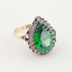 "14k Gold Hurrem Ring-Emerald Colored Zircon Stone Ottoman Style Ring A great gift for women's day. This stunning Ottoman style ring is carefully handcrafted from 14 carat gold. * Crafted in solid 14k Yellow gold and stamped \"14K\" for authenticity. * It is 100% 14k gold. (We don't sell filled or plated jewelry) * The package includes a gold certificate. * It comes with its box, ready to be given as a gift. * Free Express International Shipping 14k gold does not oxidize or discolor, so you can Hurrem Ring, Stone Ottoman, Gold Certificate, Ottoman Styling, Great Gifts For Women, Ring Emerald, Stackable Rings, Jewelry Plate, Ladies Day