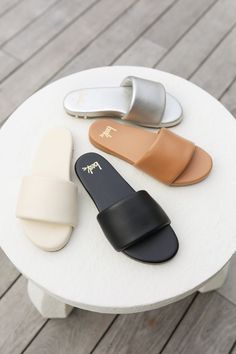 The BAZA leather slide sandal features a leather wrapped memory foam sole with molded arch. We added EXTRA padding to the platform and wrapped it in buttery-soft leather. For the upper we took the softest leather we could find and wrapped it around a cushy memory foam strap. Our commitment to sustainability is evident in our use of vegetable-tanned leathers, recycled and recyclable products, packaging, and leather sourced from tanneries certified by the Leather Working Group. Read more in the Ou Comfortable Slides With Leather Footbed And Synthetic Material, Leather Slides With Textured Footbed, Leather Slides With Removable Insole, Synthetic Slides With Leather Footbed, Comfortable Leather Slide Mules, Comfortable Leather Slides With Textured Sole, Comfortable Leather Slide Sandals, Comfortable Synthetic Slide Mules, Cushioned Slip-on Faux Leather Sandals