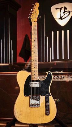 an electric guitar sitting on top of a table