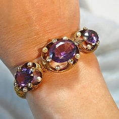 This pre-Civil War era (circa 1840) bracelet is in excellent condition. It is made up of lovely amethysts, beautiful rose cut diamonds and pearls, all set in 18K yellow gold, and weighing a total of 37.10 grams. Truly a beautiful, striking, timeless piece. This timeless bracelet comes with a bracelet gift box. Also available at LisaJJewelers is a closely matching 18K gold, amethyst and pearl pendant brooch from the same era. Identified, tested and described by a Graduate Gemologist, GIA. Antique Purple Jewelry For Wedding, Elegant Jeweled Yellow Gold Bracelet, Purple Jeweled Jewelry For Formal Occasions, Purple Jeweled Formal Jewelry, Formal Purple Jeweled Jewelry, Purple Jeweled Evening Jewelry, Antique Gemstone Bracelets For Formal Occasions, Elegant Oval Jeweled Bracelets, Jeweled Amethyst Jewelry For Formal Occasions